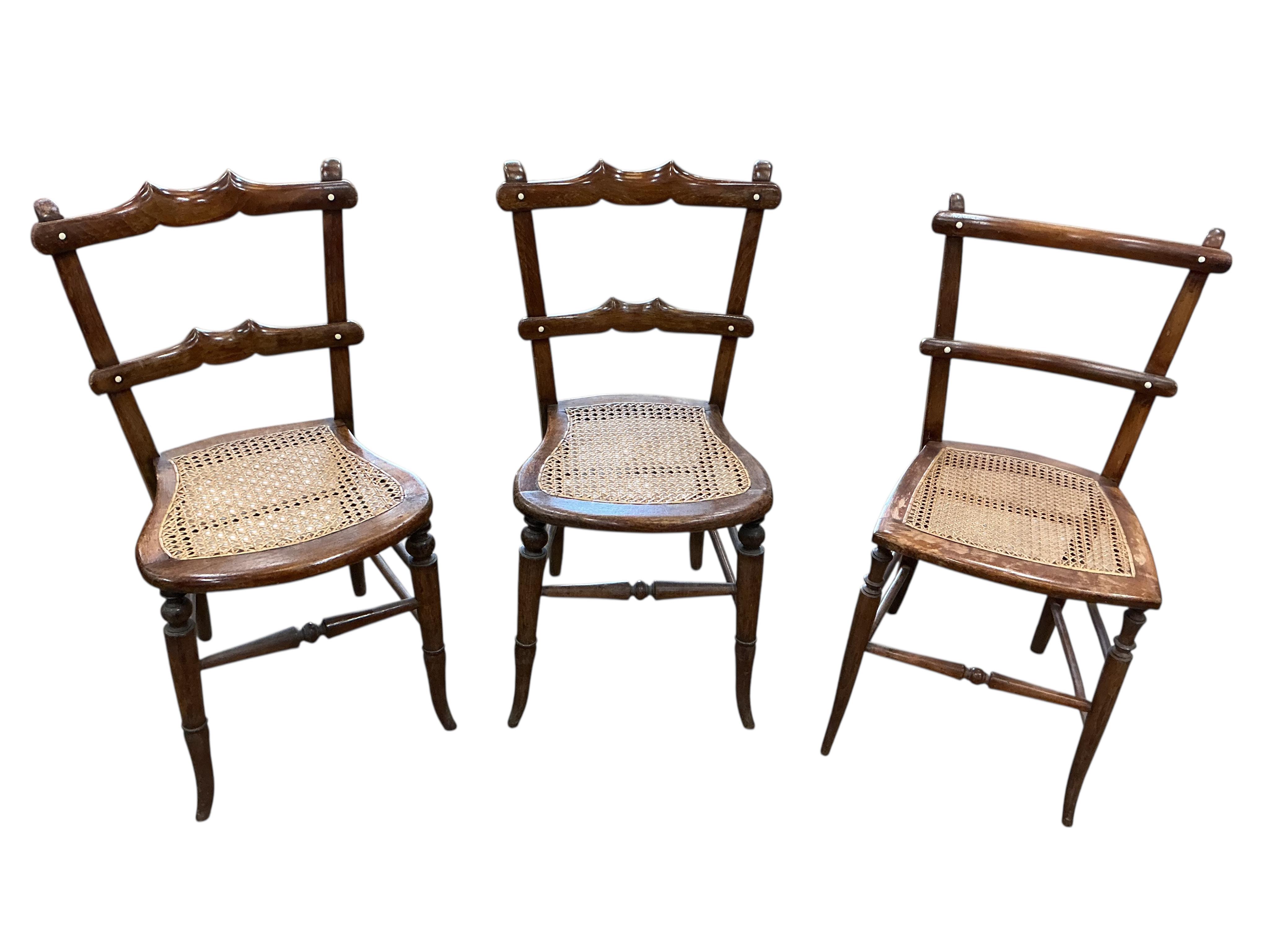 A harlequin set of six 19th century French beech cane seat chairs